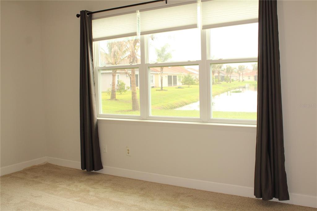 6969 Indus Valley Circle Parrish, FL 34219 - Photo 14 of 49 a view of an empty room with a window