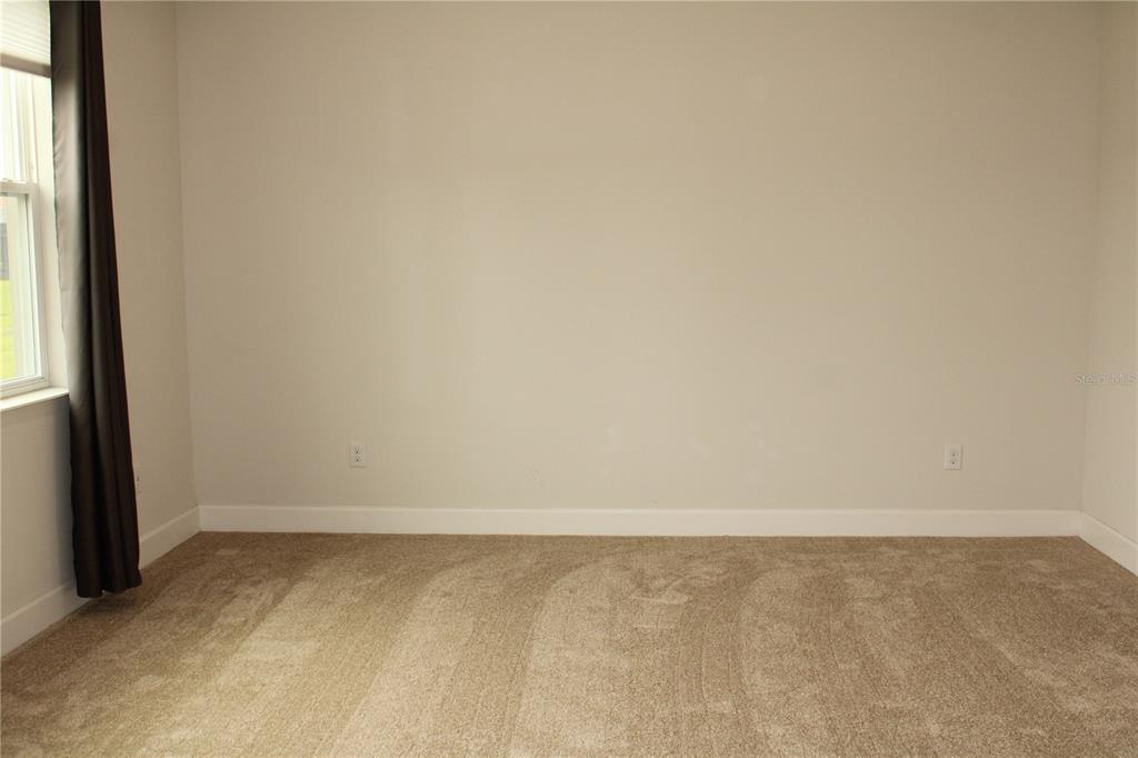 6969 Indus Valley Circle Parrish, FL 34219 - Photo 16 of 49 a view of an empty room and window