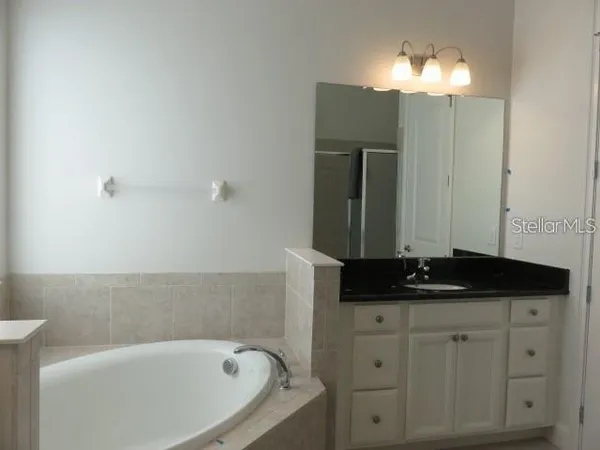 a bathroom with a bathtub and a sink