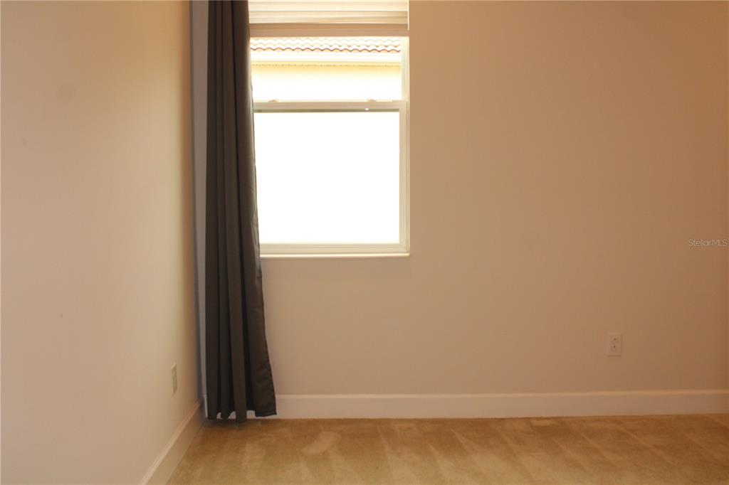 6969 Indus Valley Circle Parrish, FL 34219 - Photo 20 of 49 a view of an empty room and window