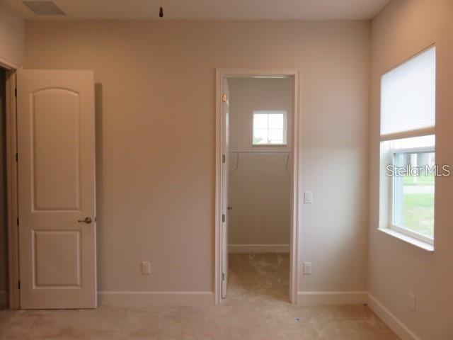 6969 Indus Valley Circle Parrish, FL 34219 - Photo 24 of 49 an empty room with windows and closet
