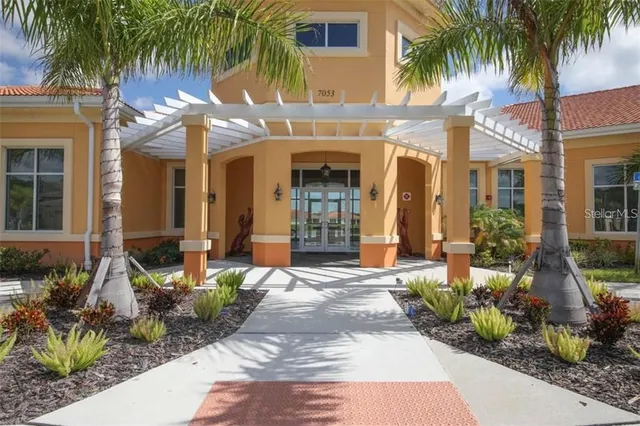 swimming pool view with a seating space
