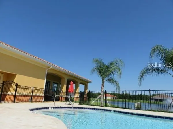 a view of swimming pool with a yard