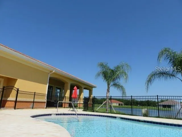 a view of swimming pool with a yard