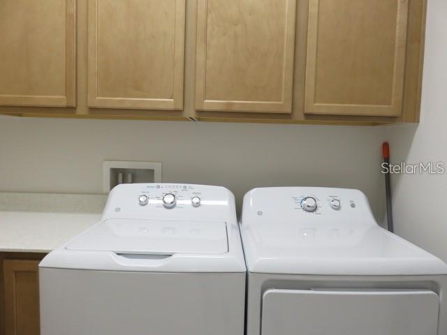 6969 Indus Valley Circle Parrish, FL 34219 - Photo 28 of 49 a utility room with dryer and washer
