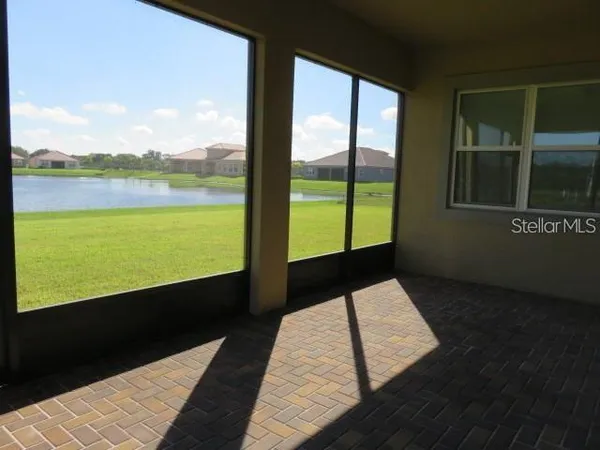 a view of a bathroom with a tub and shower