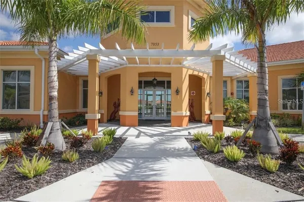 swimming pool view with a seating space