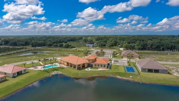 a living room with furniture window and a flat screen tv