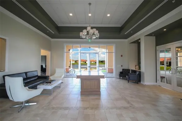 a living room with lots of furniture and a window