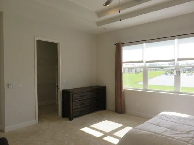 a bed room with a bed and a window