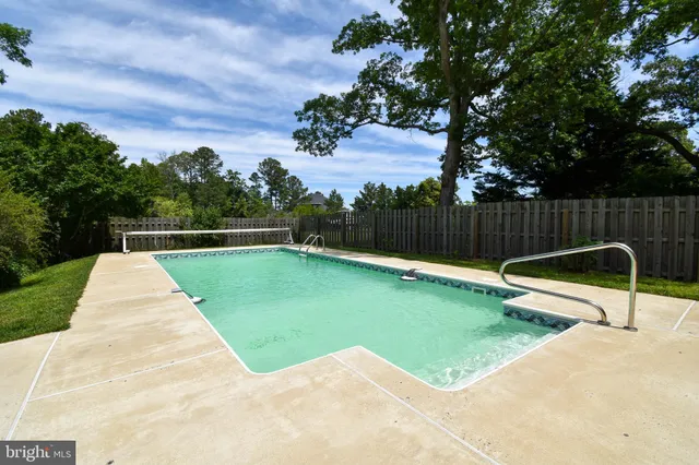 a view of a backyard with a small pool
