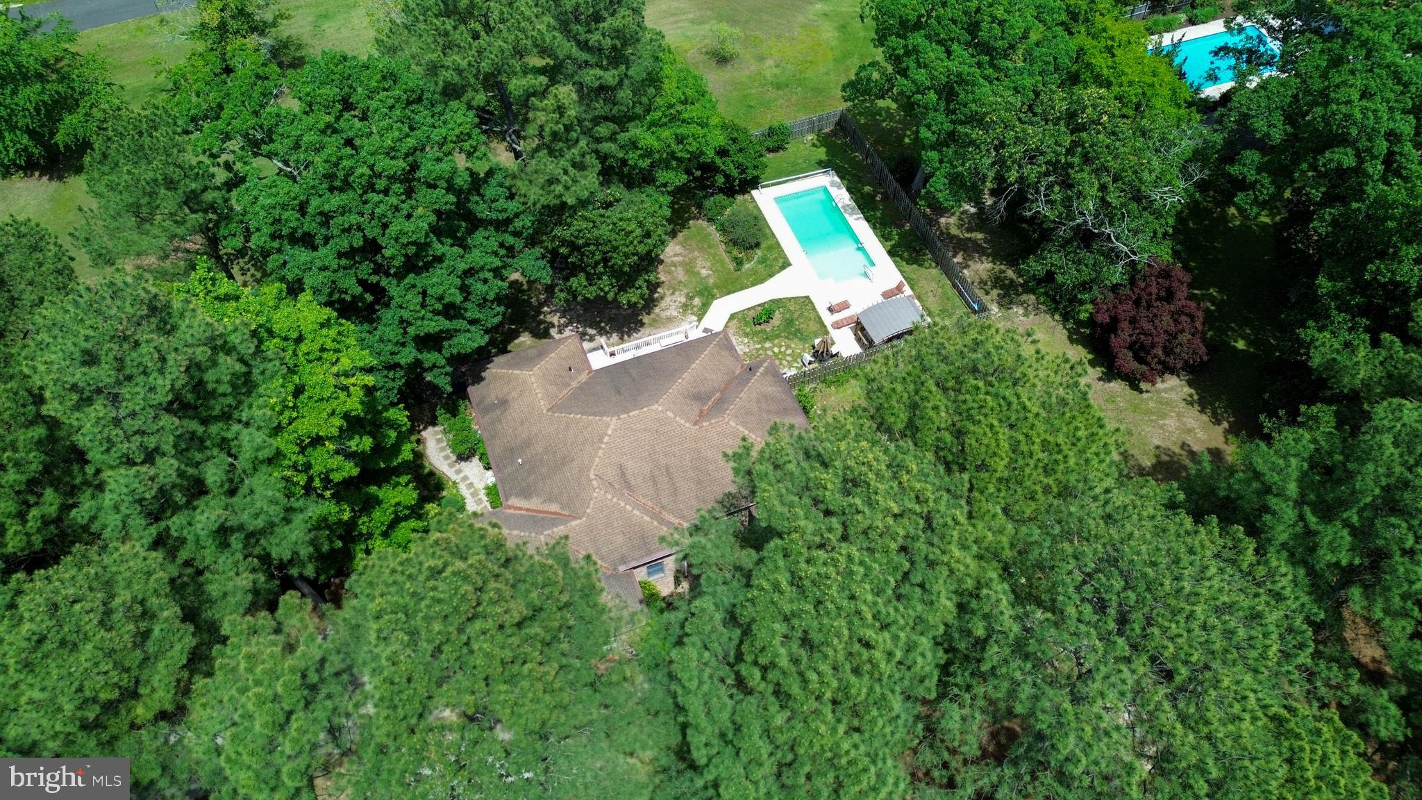 1 Bay Point Road Millsboro, DE 19966 - Photo 26 of 26 an aerial view of a house with a yard and tree s