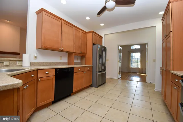 a kitchen with a sink cabinets and appliances