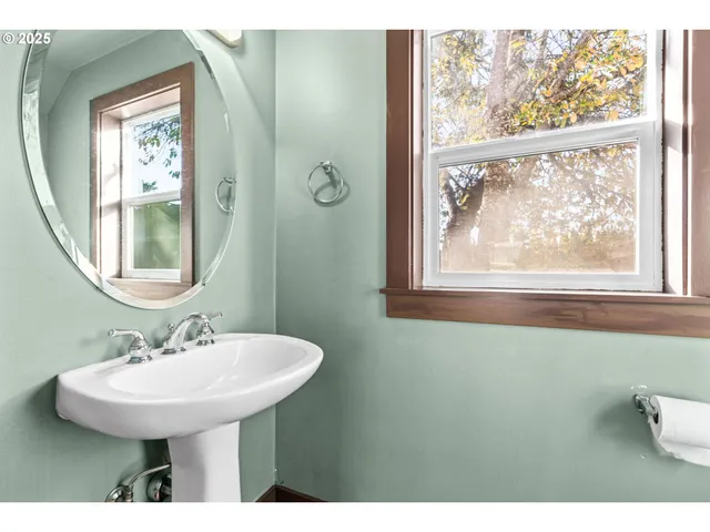 a kitchen with granite countertop a refrigerator and a stove top oven