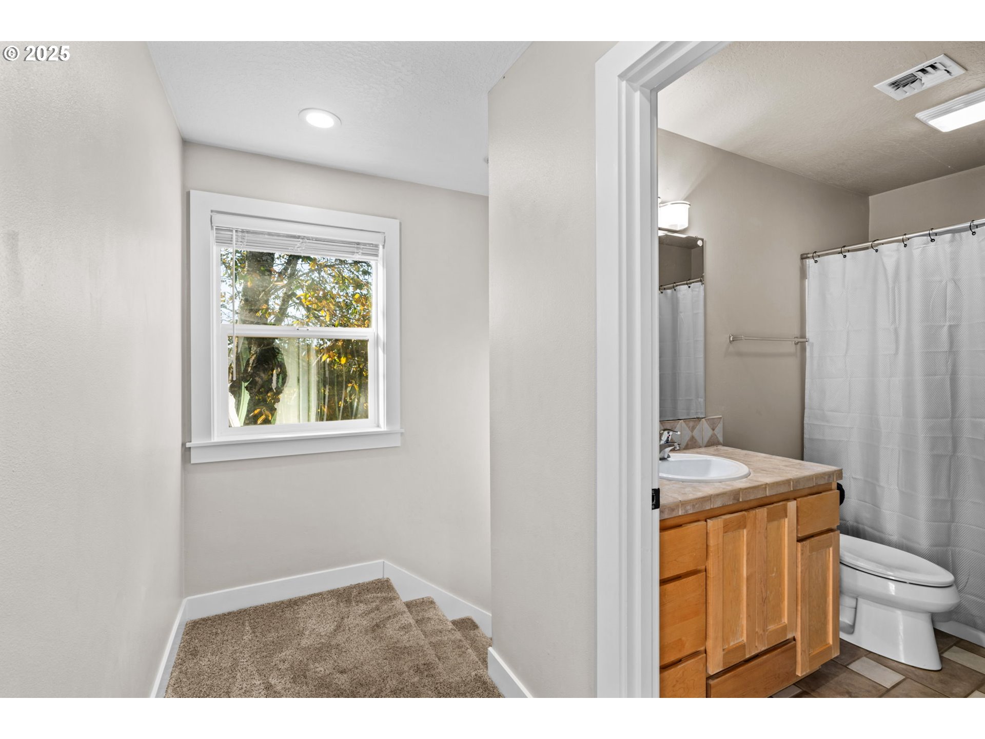 1072 53rd Street Springfield, OR 97478 - Photo 18 of 32 a bathroom with a sink a toilet and shower