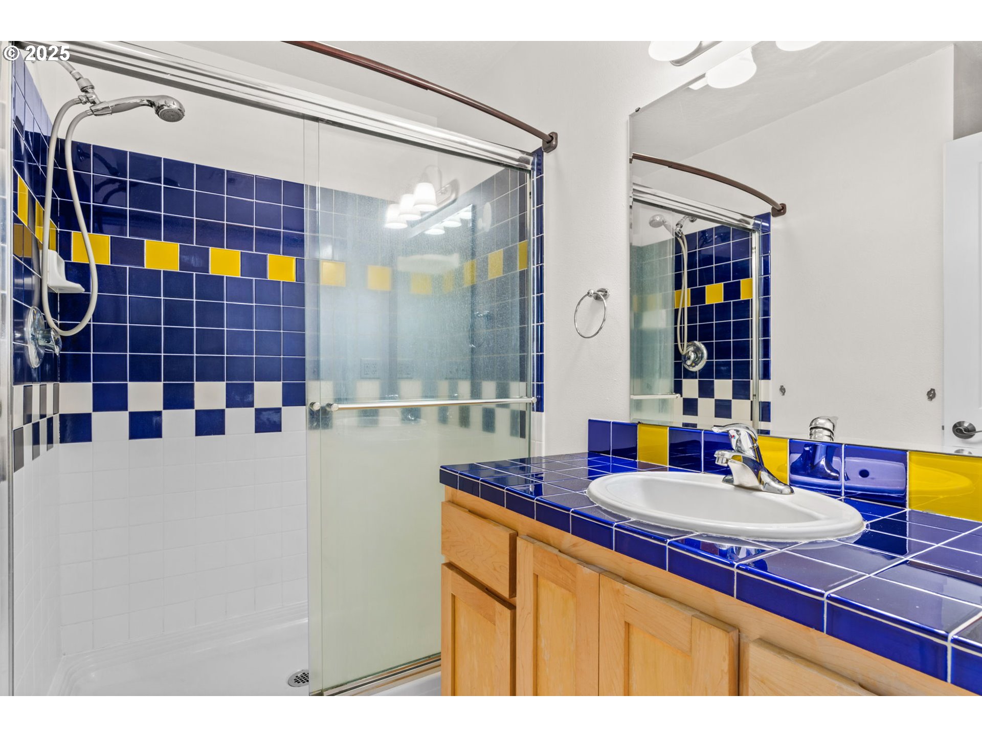 1072 53rd Street Springfield, OR 97478 - Photo 24 of 32 a bathroom with a sink double vanity and a mirror