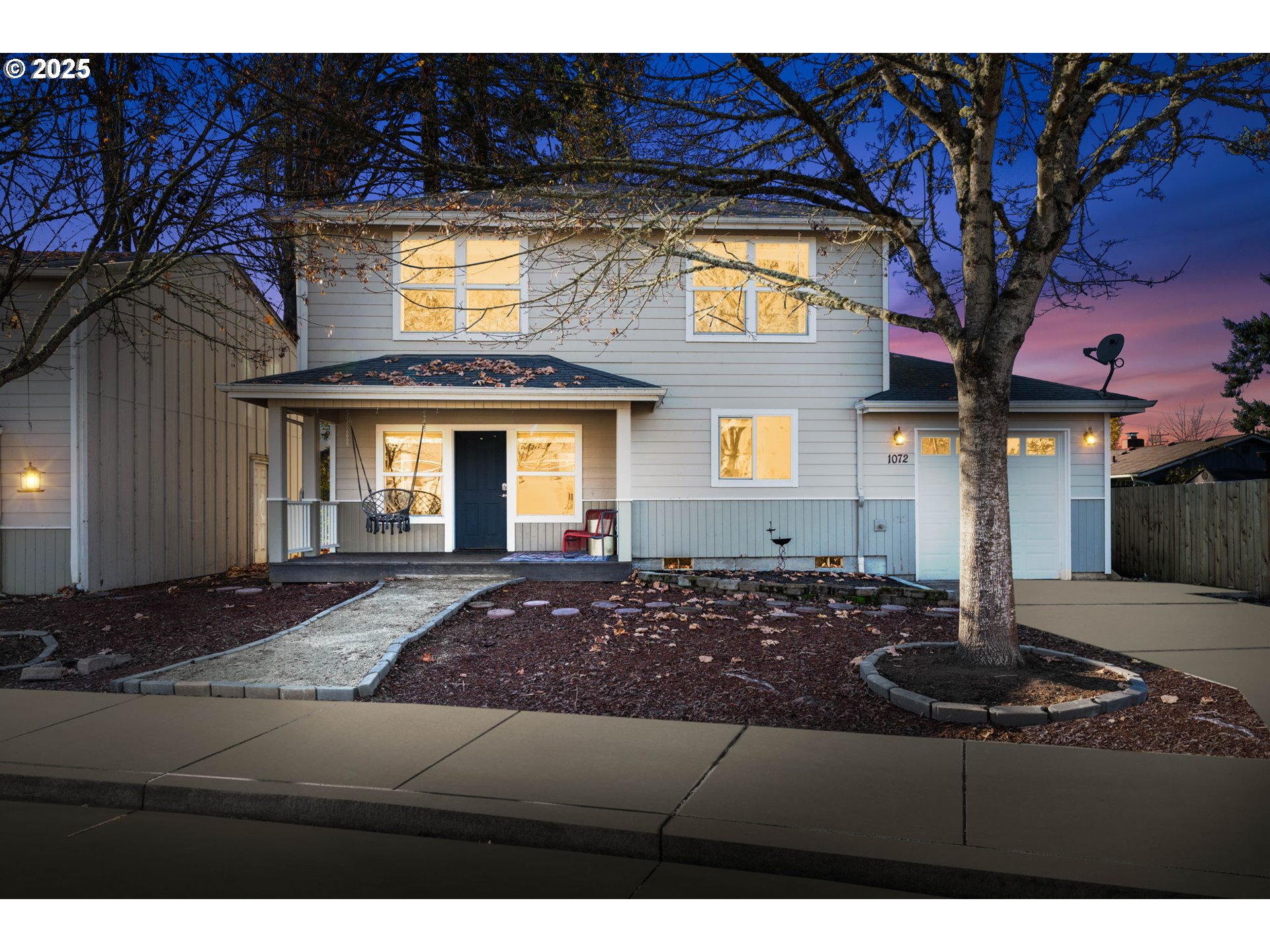 1072 53rd Street Springfield, OR 97478 - Photo 5 of 32 a living room with a couch and a chandelier