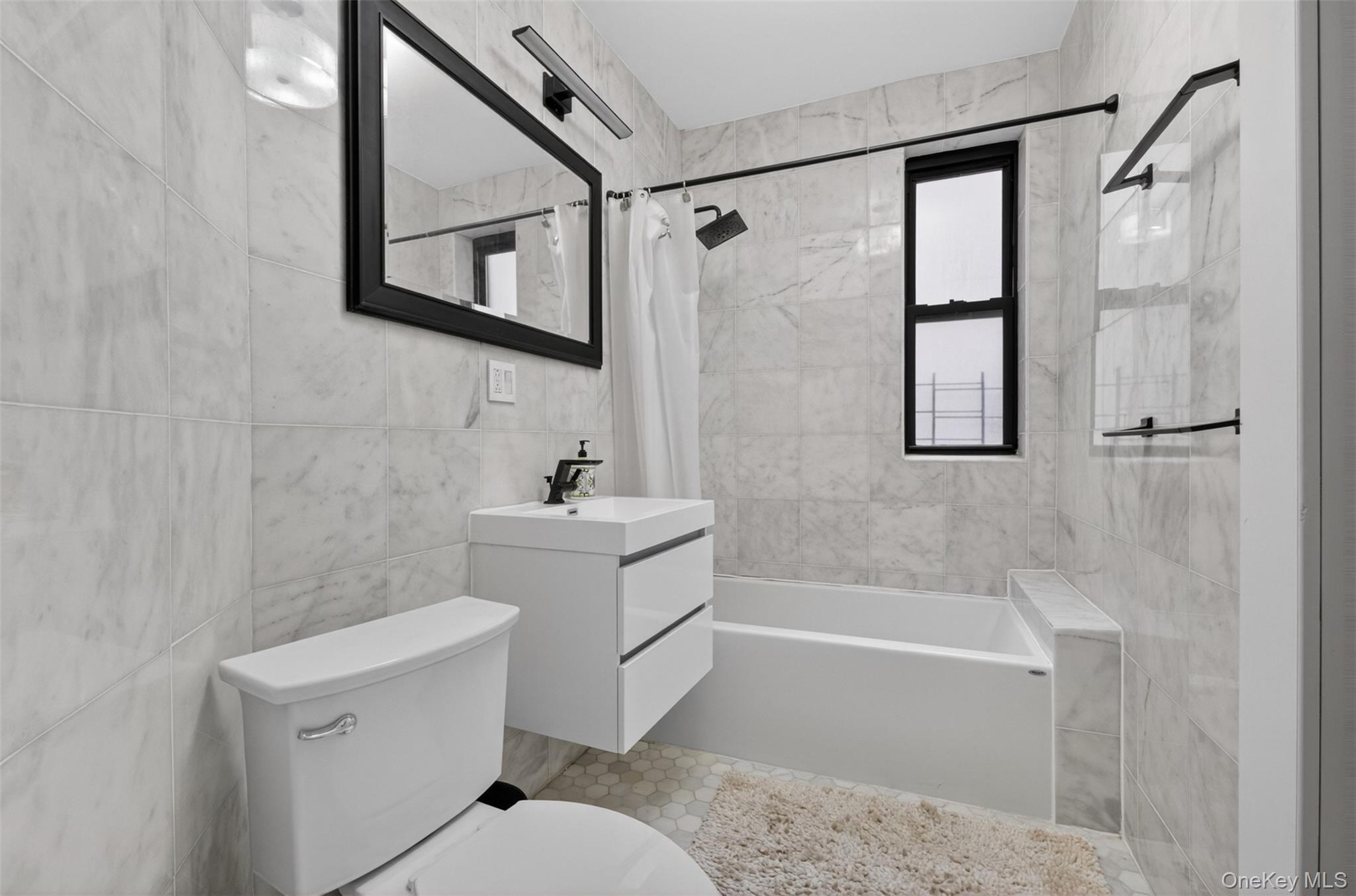812 Riverside Drive, Unit 42 Manhattan, NY 10032 - Photo 12 of 19 a bathroom with a sink a toilet and shower