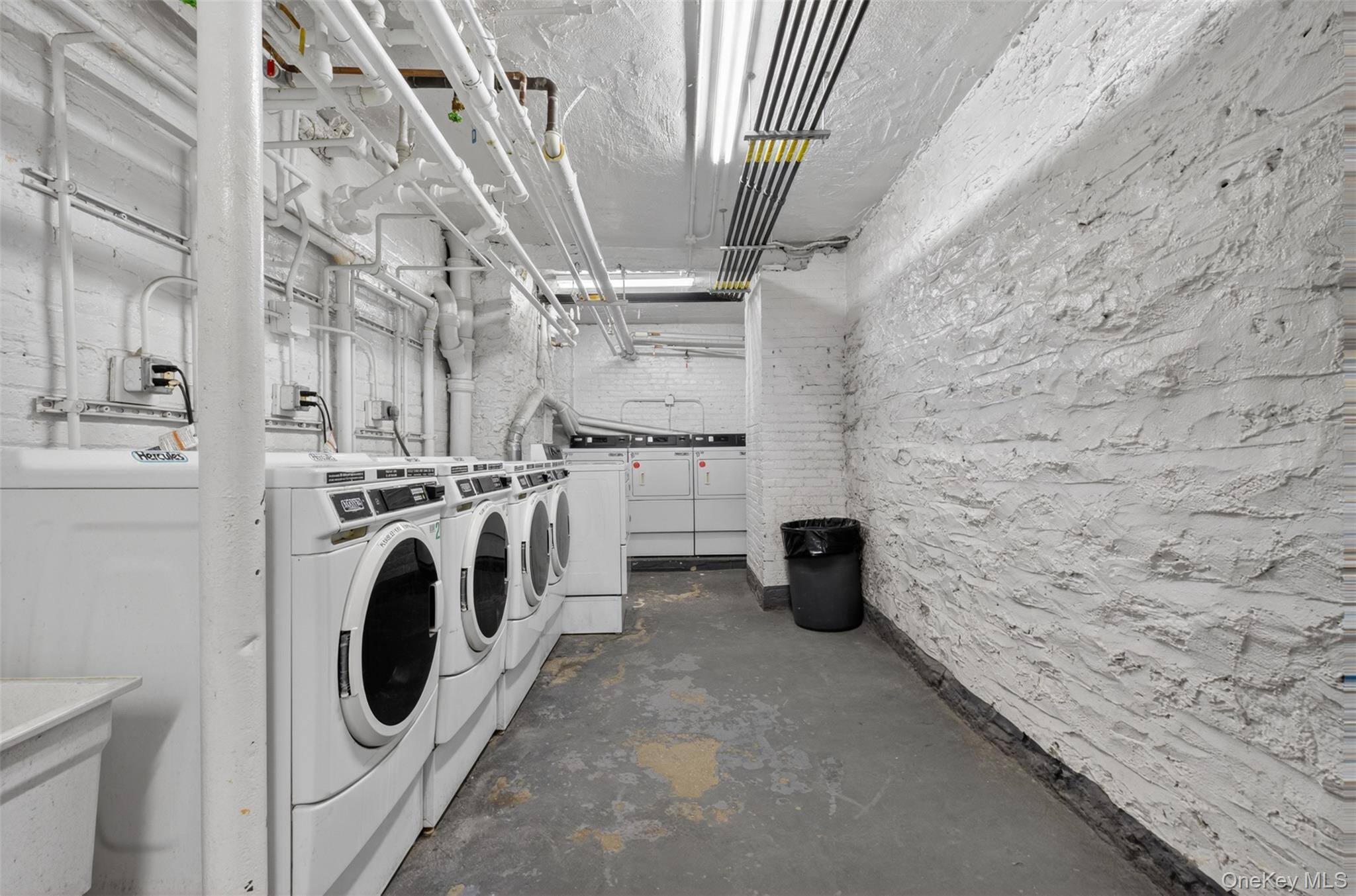812 Riverside Drive, Unit 42 Manhattan, NY 10032 - Photo 18 of 19 a utility room with dryer and washer