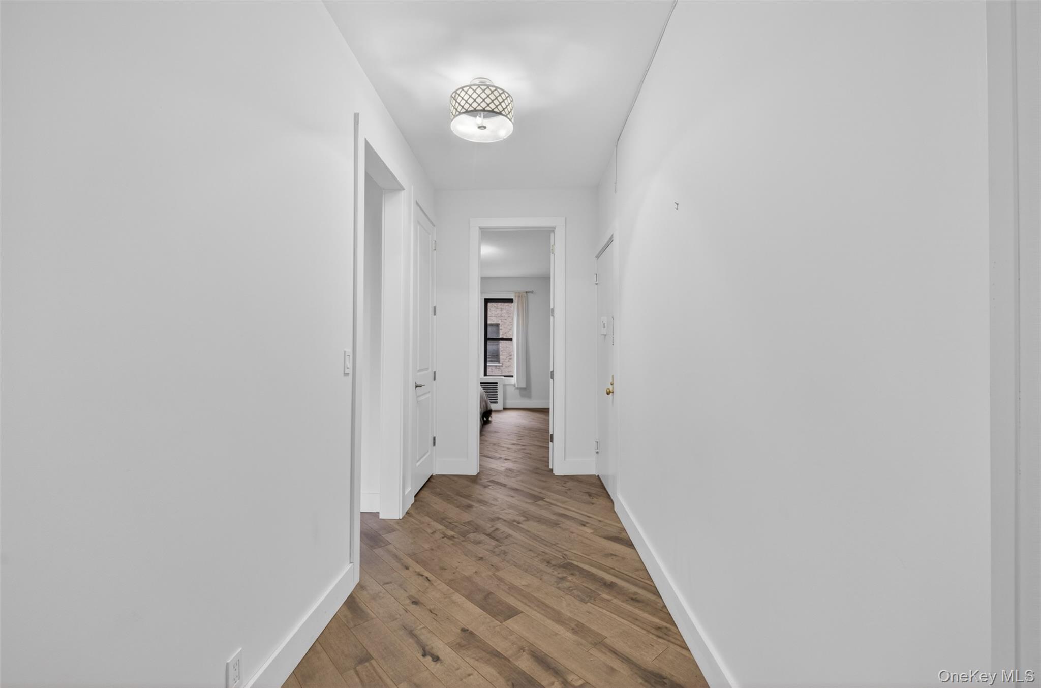 812 Riverside Drive, Unit 42 Manhattan, NY 10032 - Photo 6 of 19 a view of a hallway with wooden floor