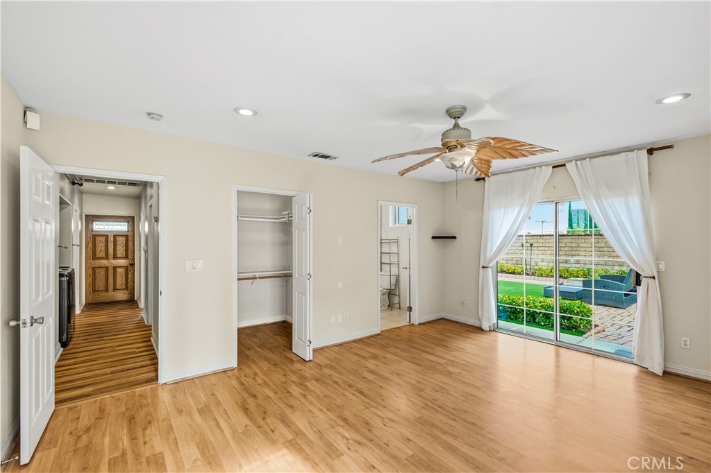 5204 Etiwanda Avenue Tarzana, CA 91356 - Photo 13 of 23 a view of a room with wooden floor fan and windows