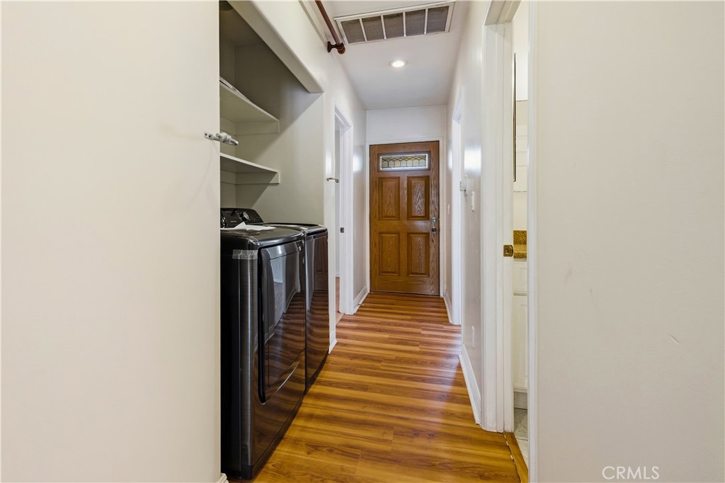 5204 Etiwanda Avenue Tarzana, CA 91356 - Photo 15 of 23 a view of a hallway with wooden floor and staircase