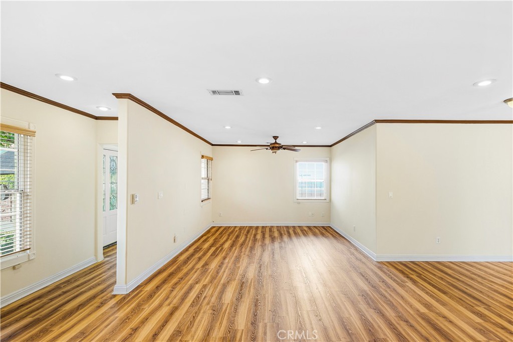 5204 Etiwanda Avenue Tarzana, CA 91356 - Photo 6 of 23 a view of empty room with wooden floor and fan