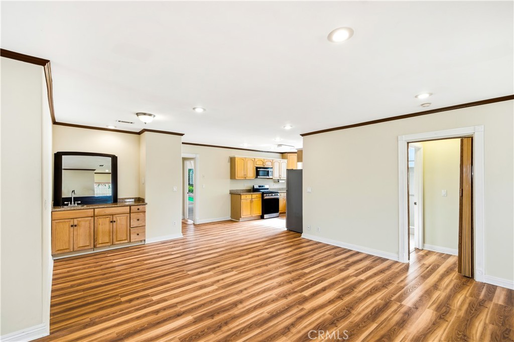 5204 Etiwanda Avenue Tarzana, CA 91356 - Photo 8 of 23 a view of a kitchen with a sink and a refrigerator