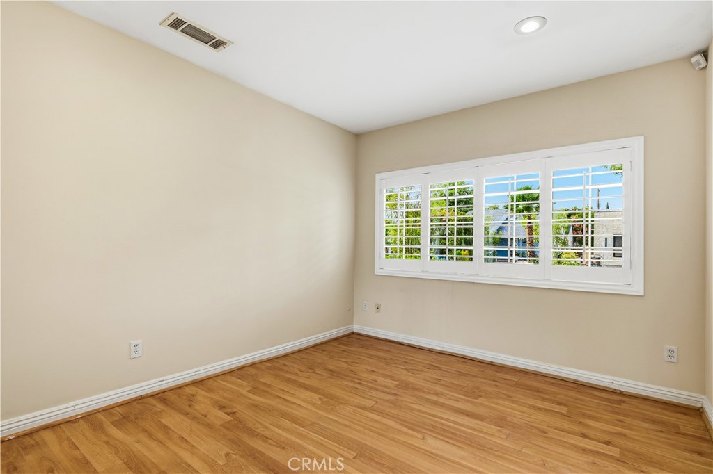 5204 Etiwanda Avenue Tarzana, CA 91356 - Photo 10 of 23 a view of an empty room with wooden floor and a window