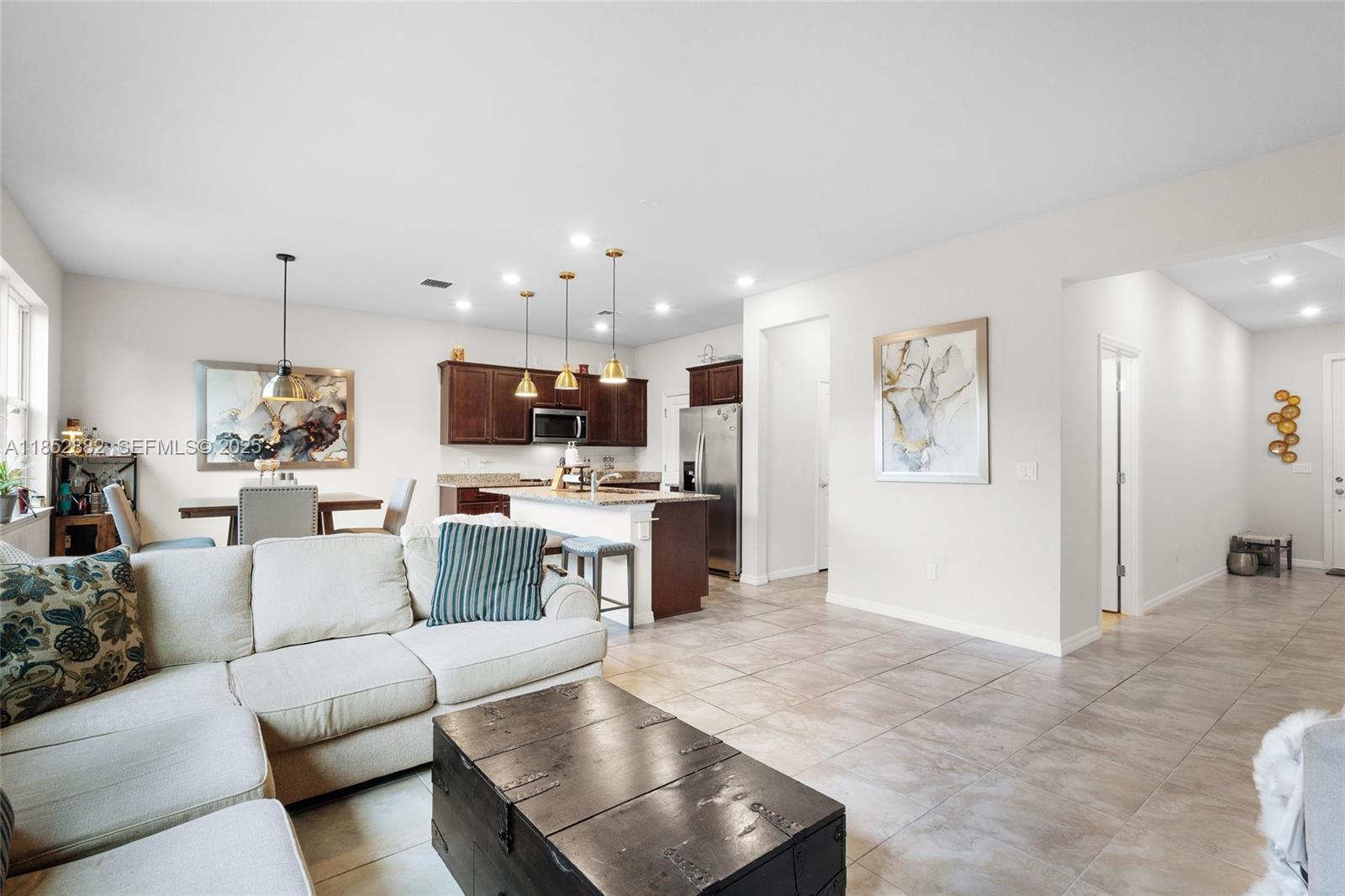 4248 Ficus Street Hollywood, FL 33021 - Photo 11 of 69 a living room with furniture and kitchen view