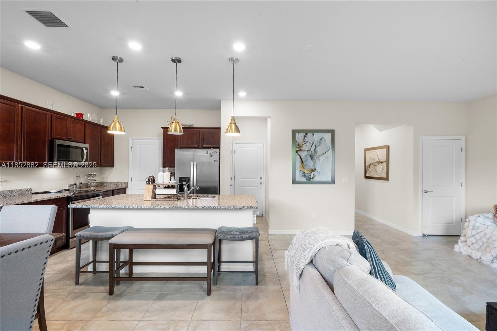 4248 Ficus Street Hollywood, FL 33021 - Photo 15 of 69 a living room with kitchen furniture and a wooden floor