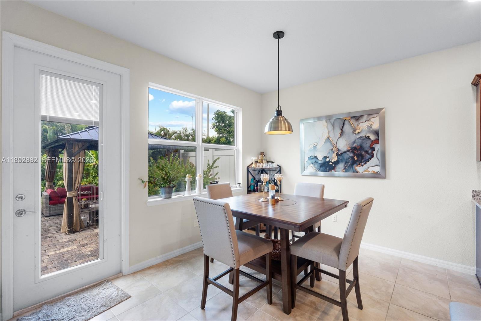 4248 Ficus Street Hollywood, FL 33021 - Photo 16 of 69 a view of a dining room with furniture window and wooden floor