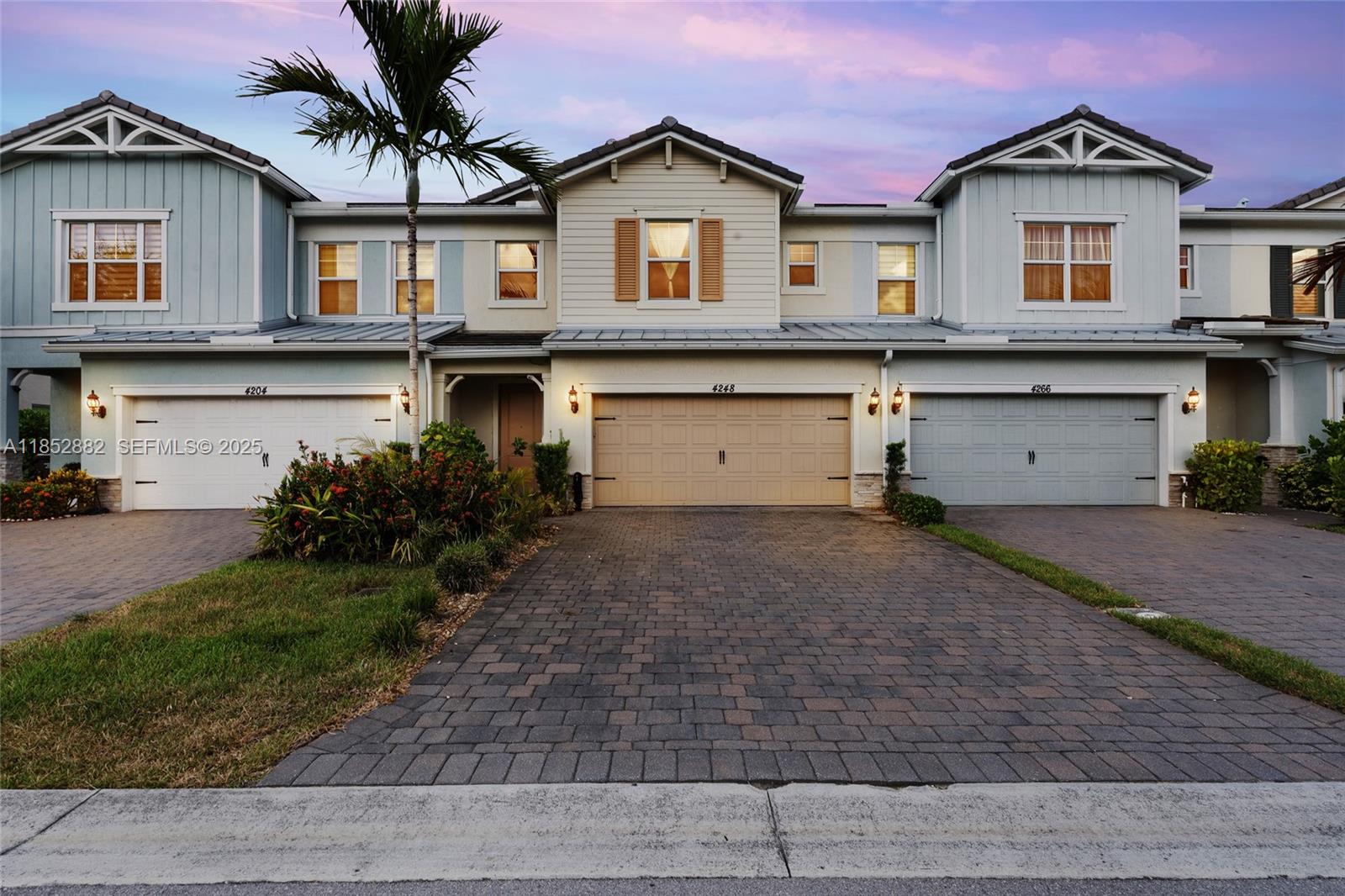 4248 Ficus Street Hollywood, FL 33021 - Photo 2 of 69 a front view of a house with a yard and garage