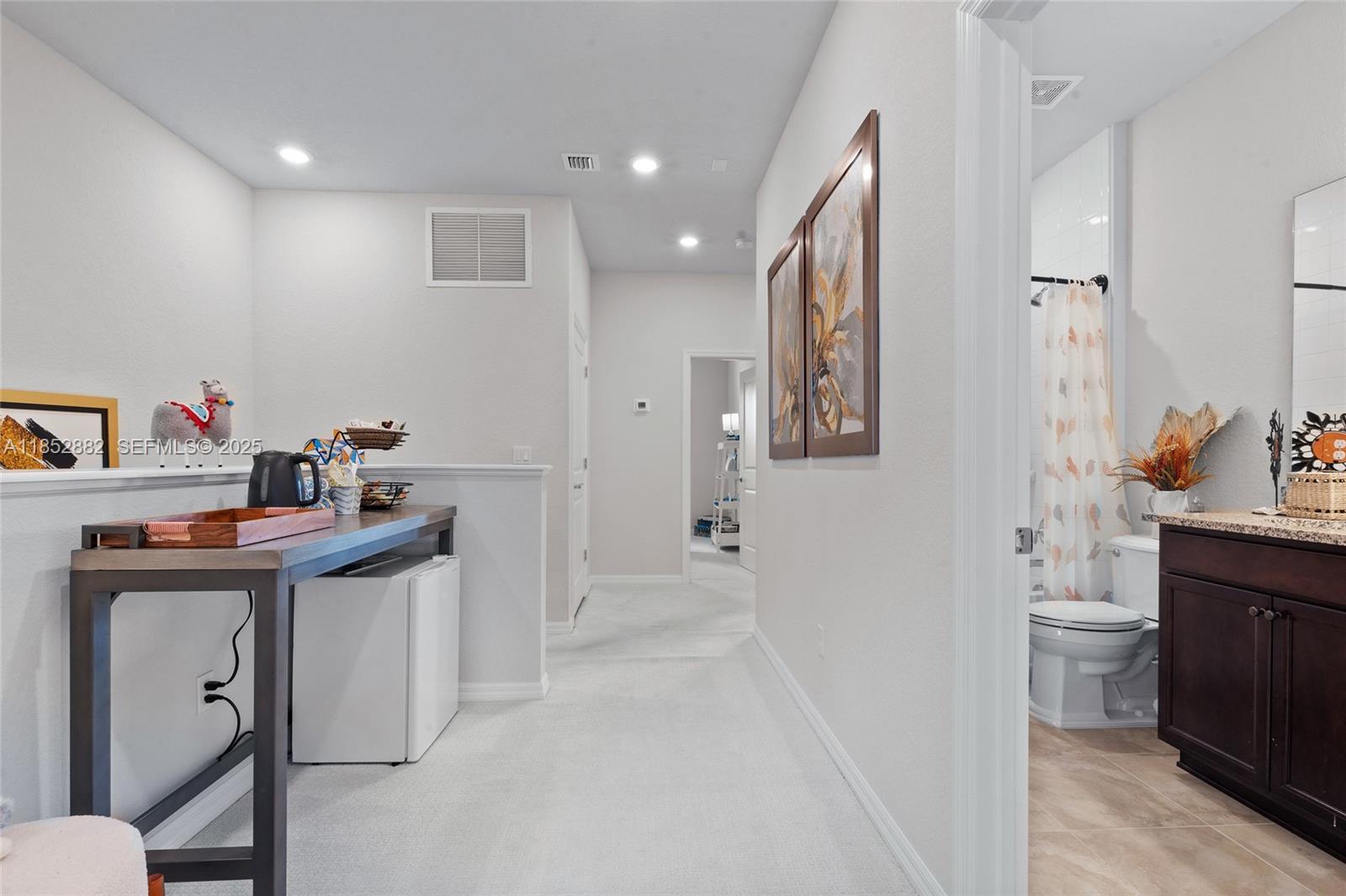 4248 Ficus Street Hollywood, FL 33021 - Photo 25 of 69 a bathroom with a sink a toilet and a mirror