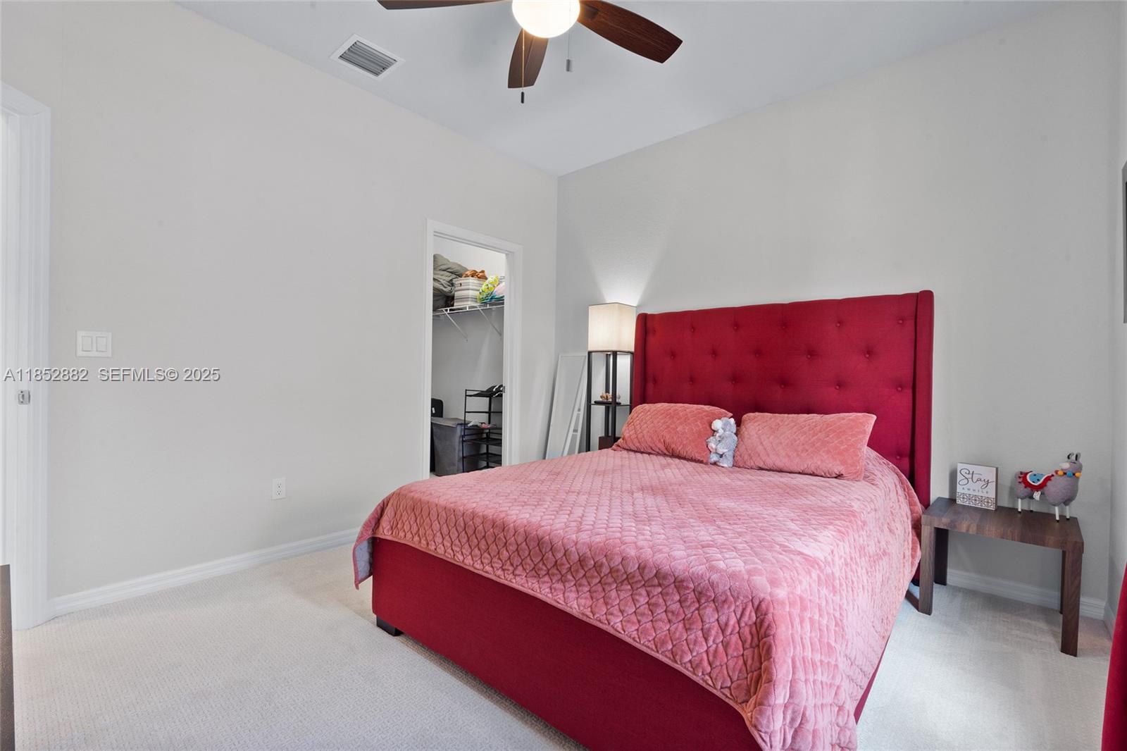 4248 Ficus Street Hollywood, FL 33021 - Photo 29 of 69 a bedroom with a bed and a chandelier
