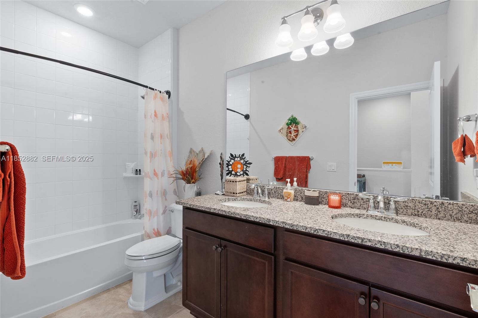 4248 Ficus Street Hollywood, FL 33021 - Photo 30 of 69 a bathroom with a granite countertop sink a toilet and shower