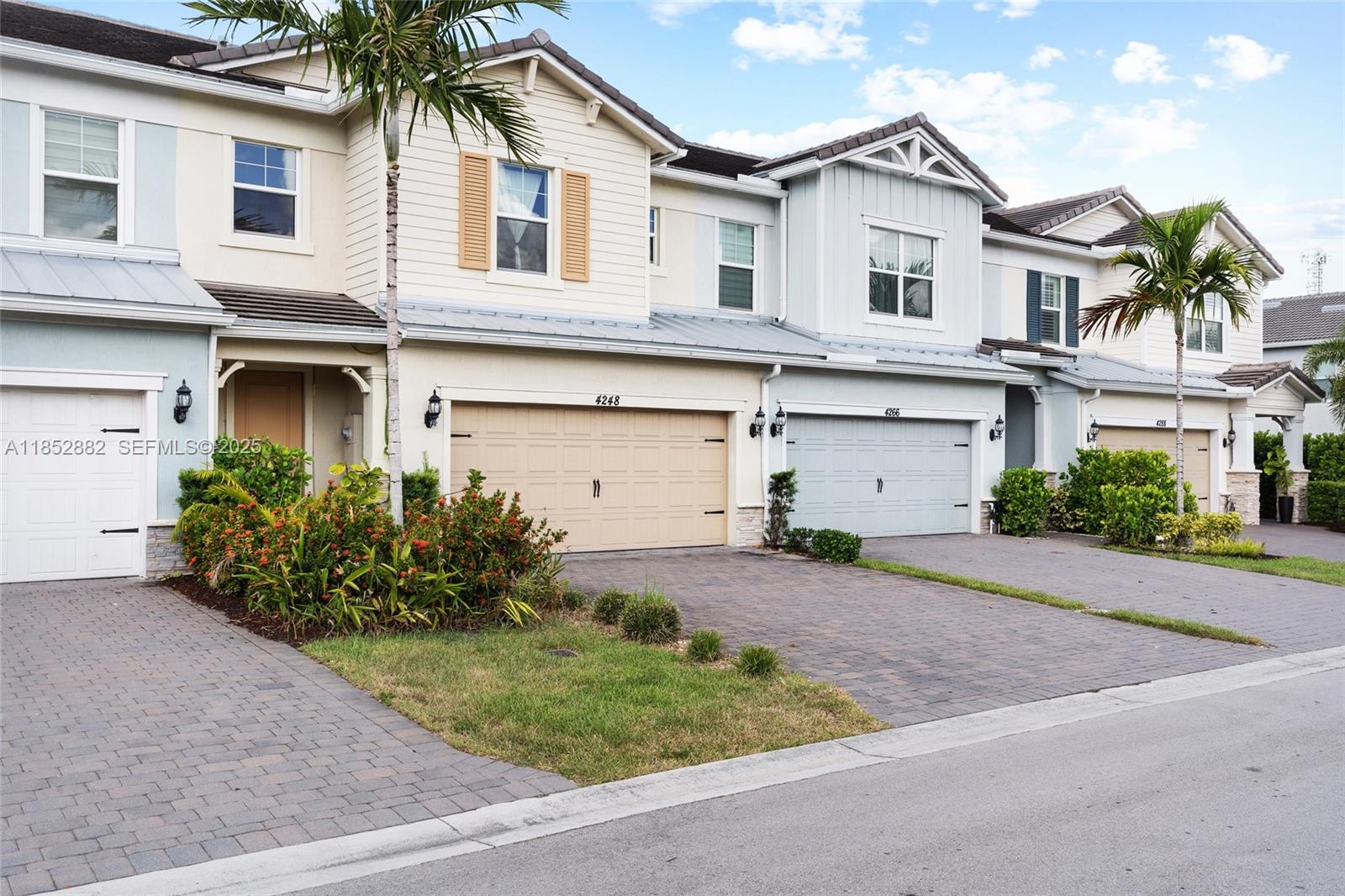 4248 Ficus Street Hollywood, FL 33021 - Photo 3 of 69 a front view of a house with a yard and garage