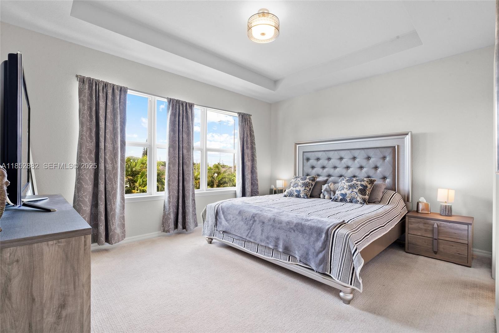 4248 Ficus Street Hollywood, FL 33021 - Photo 32 of 69 a bedroom with a bed and large windows