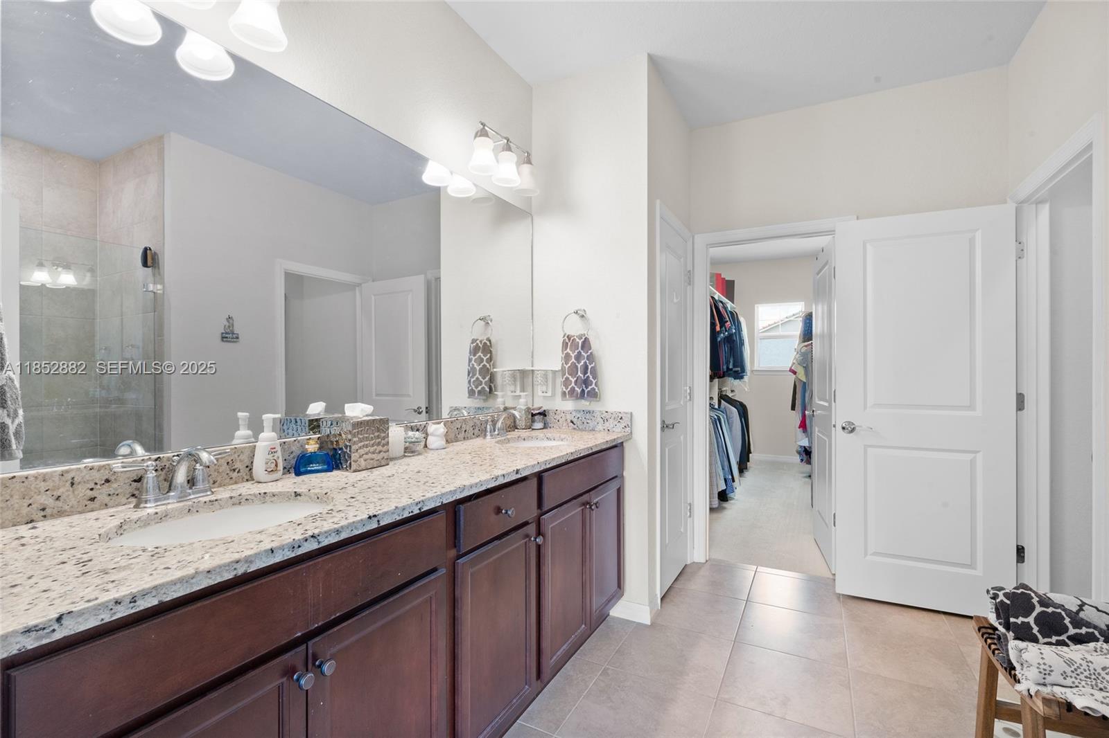 4248 Ficus Street Hollywood, FL 33021 - Photo 34 of 69 a bathroom with a granite countertop sink mirror and a