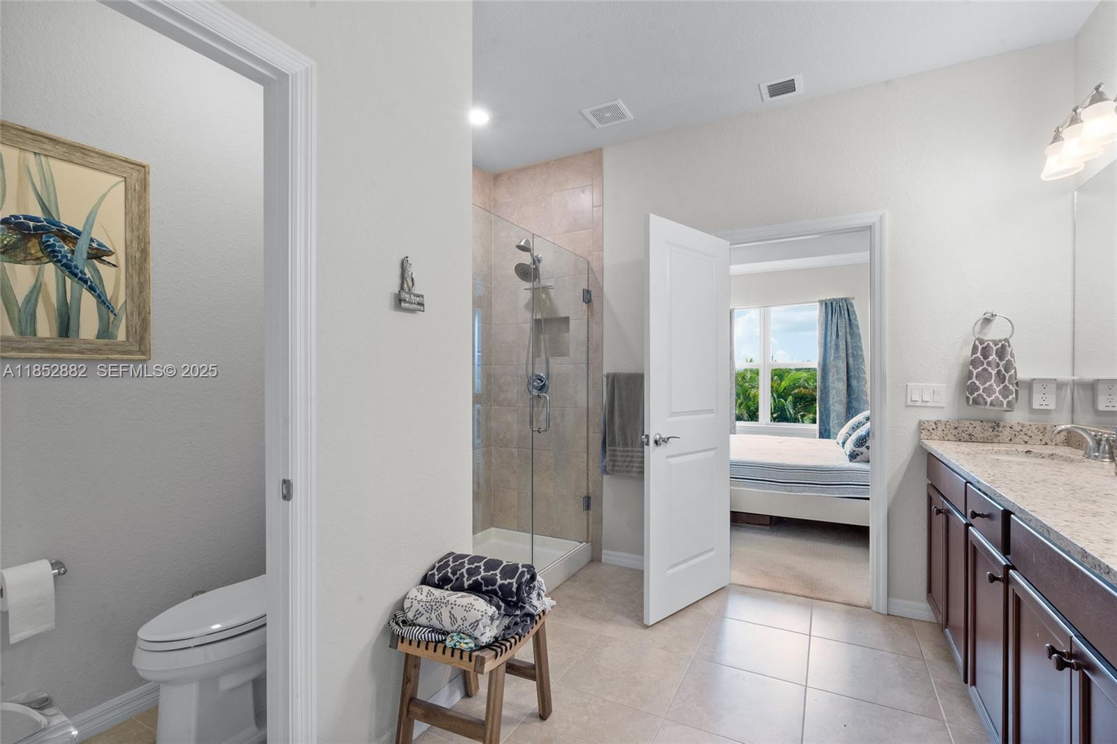 4248 Ficus Street Hollywood, FL 33021 - Photo 36 of 69 a spacious bathroom with a granite countertop sink a toilet and shower