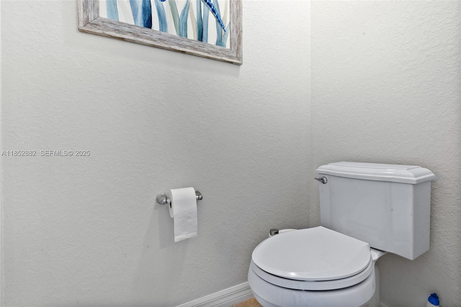 4248 Ficus Street Hollywood, FL 33021 - Photo 38 of 69 a white toilet sitting next to a white wall