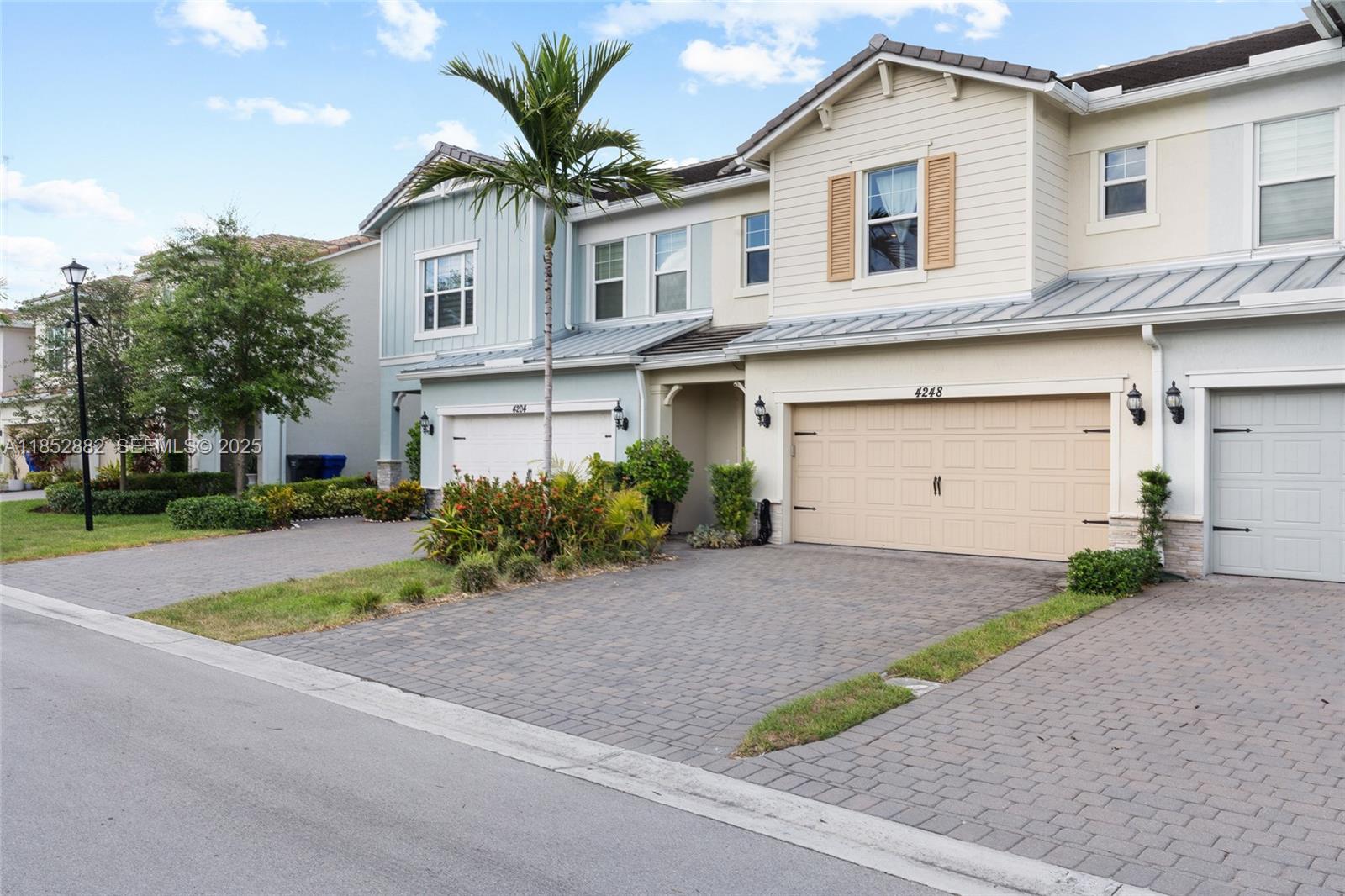 4248 Ficus Street Hollywood, FL 33021 - Photo 4 of 69 a front view of a house with a yard and a garage
