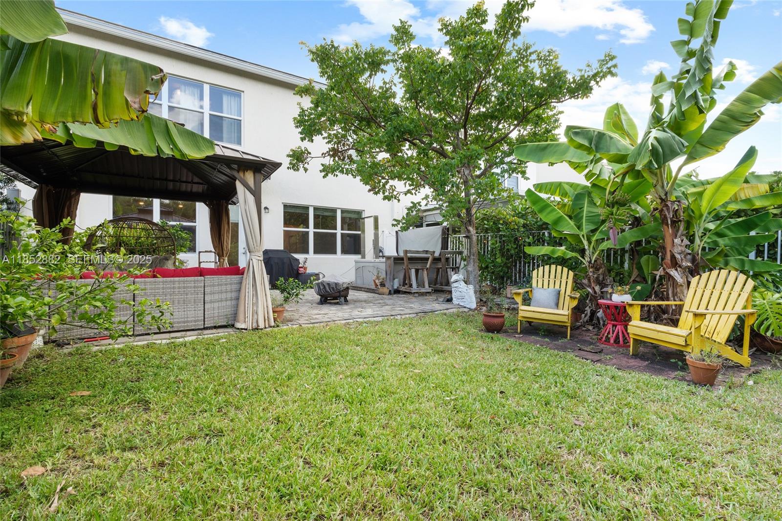 4248 Ficus Street Hollywood, FL 33021 - Photo 43 of 69 a view of a house with backyard sitting area and garden