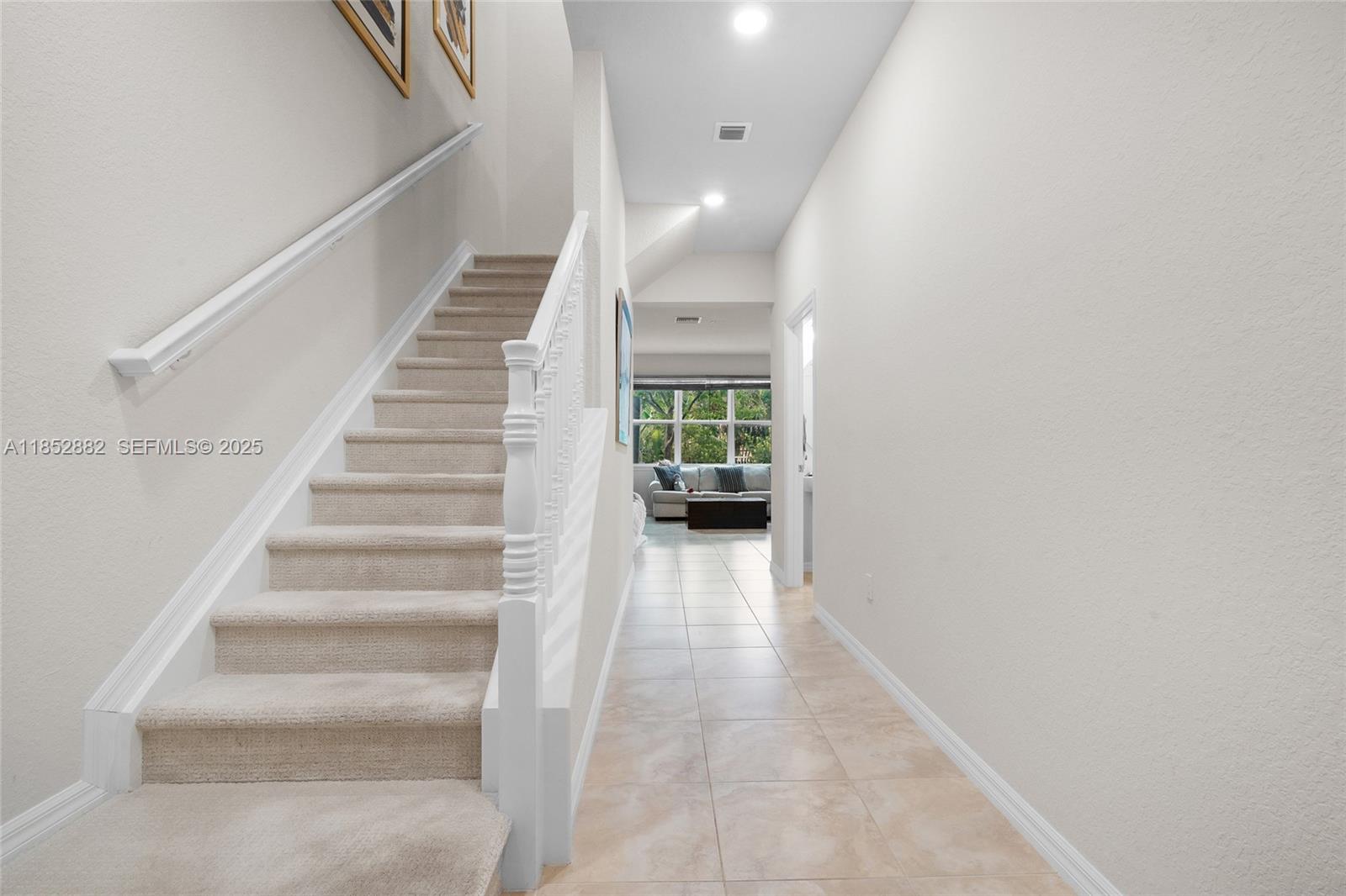 4248 Ficus Street Hollywood, FL 33021 - Photo 6 of 69 a view of staircase with white walls and white walls