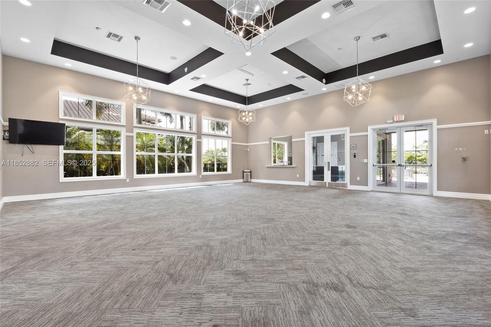 4248 Ficus Street Hollywood, FL 33021 - Photo 65 of 69 a view of an empty room with a window and a ceiling fan