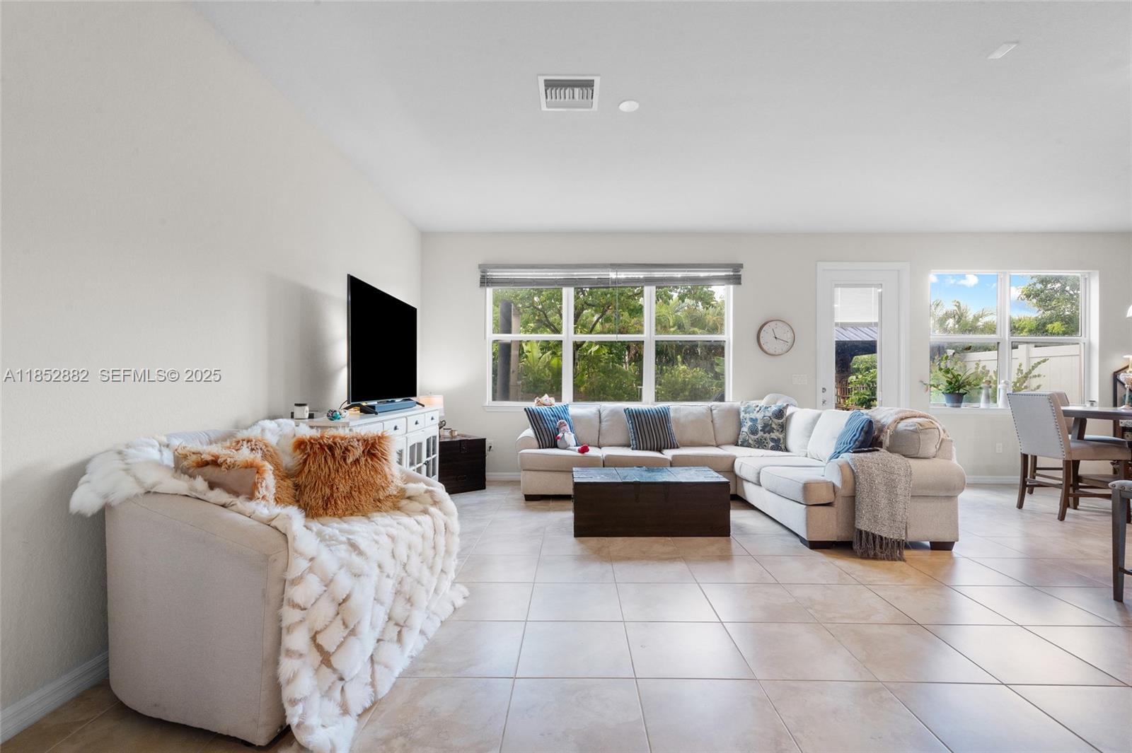 4248 Ficus Street Hollywood, FL 33021 - Photo 9 of 69 a living room with furniture and a flat screen tv