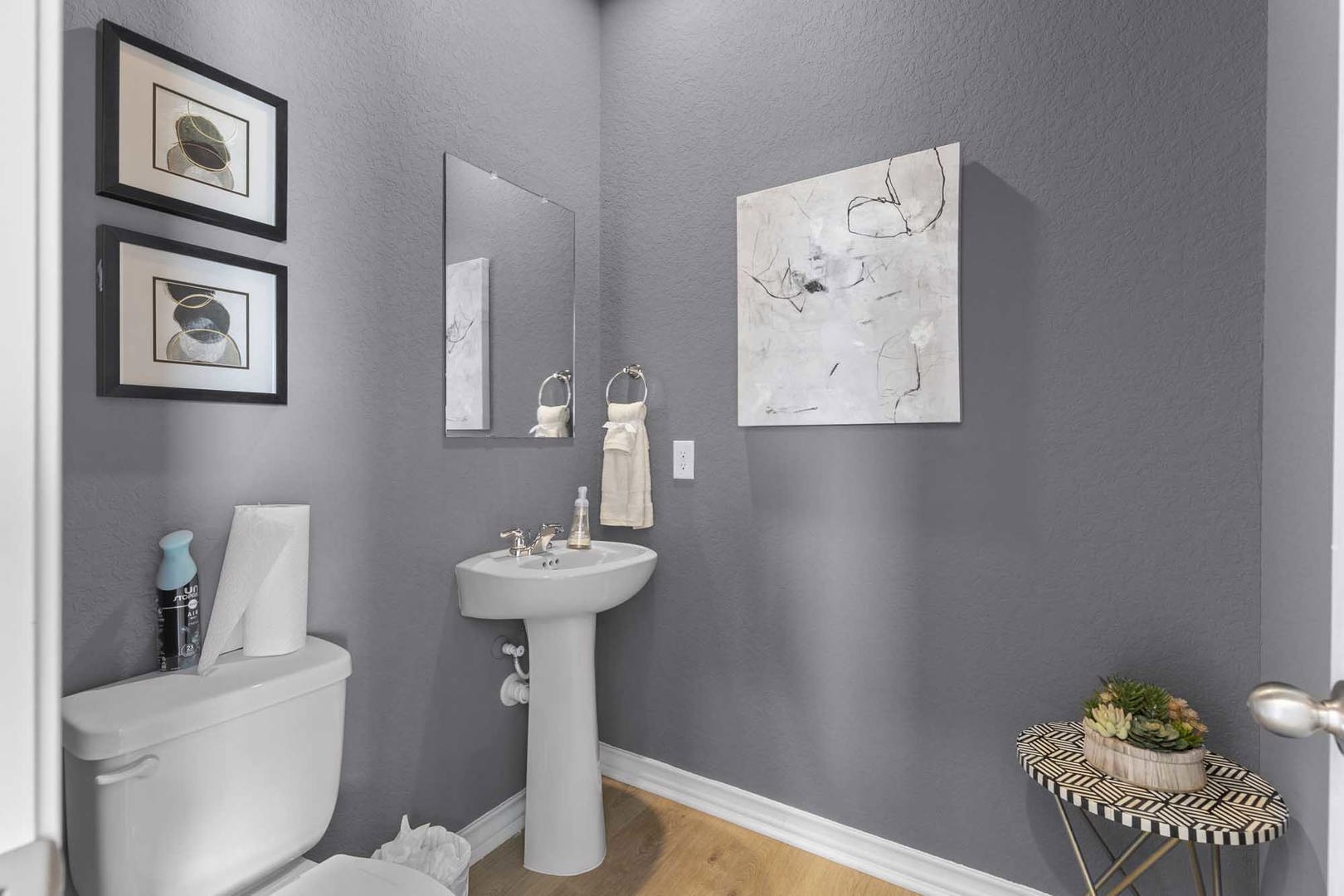 105 Hatari Trail Jarrell, TX 76537 - Photo 17 of 27 Clean lines and warm wood flooring define this classic powder room.