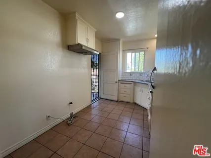 a view of a kitchen with electric appliances