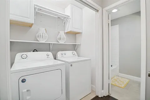 a view of storage and utility room with washer and dryer