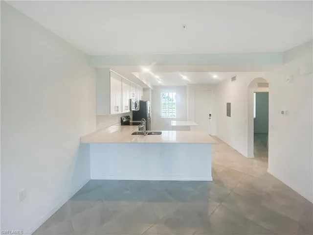 a view of kitchen with center island and natural light